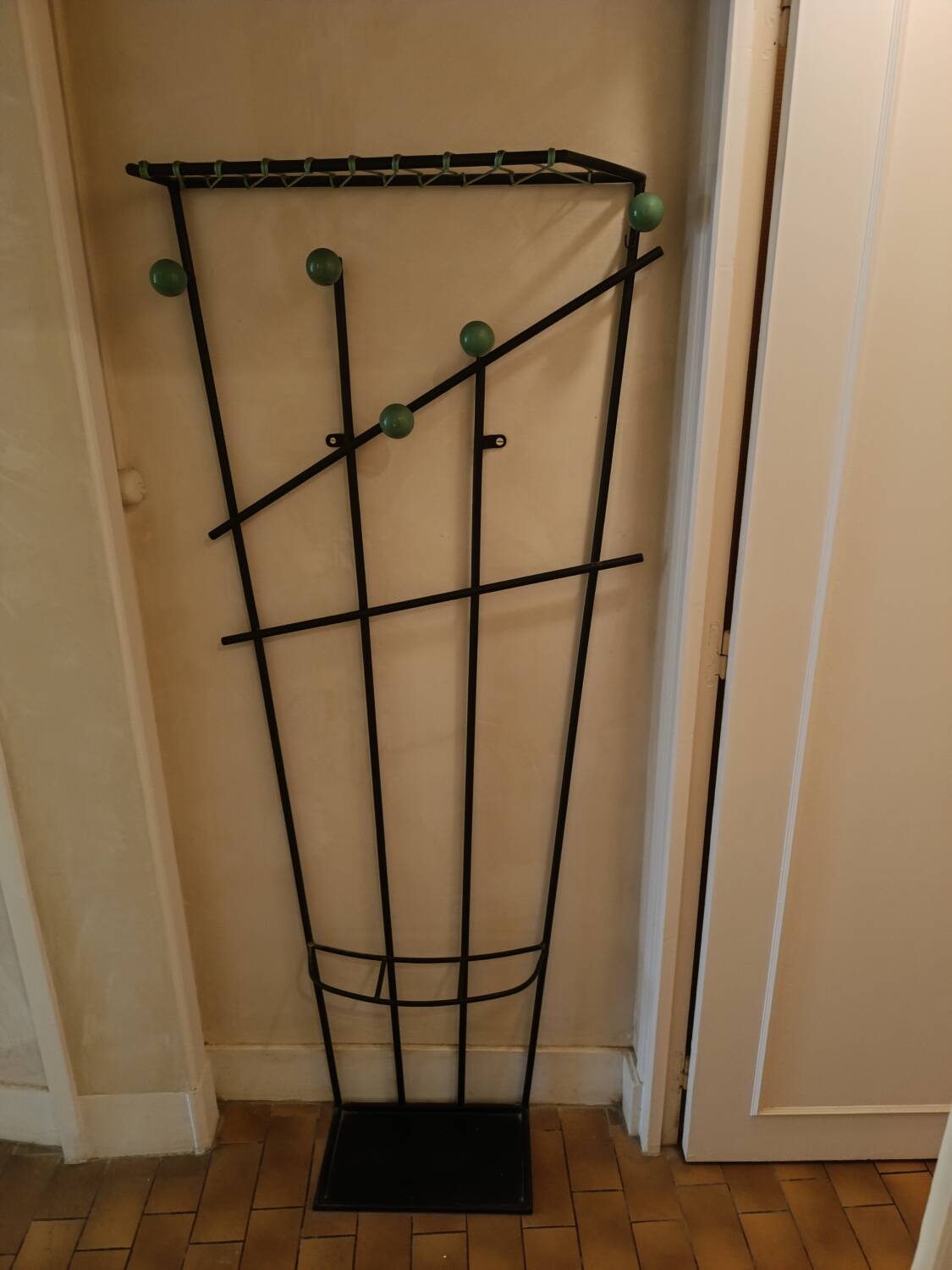 Wall-mounted metal coat rack