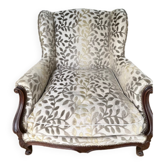Antique upholstery armchair with ears