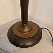 Vintage lamp base in Scandinavian style made of dark wood and bronze metal.