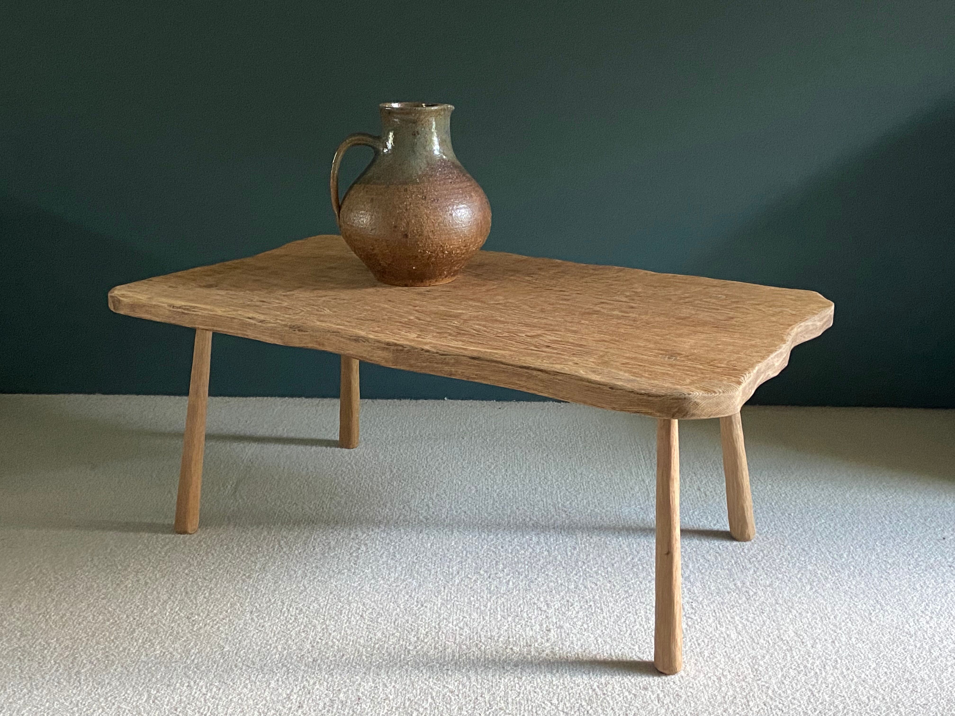 Free-form raw wood coffee table