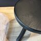 Small black wooden tripod stool