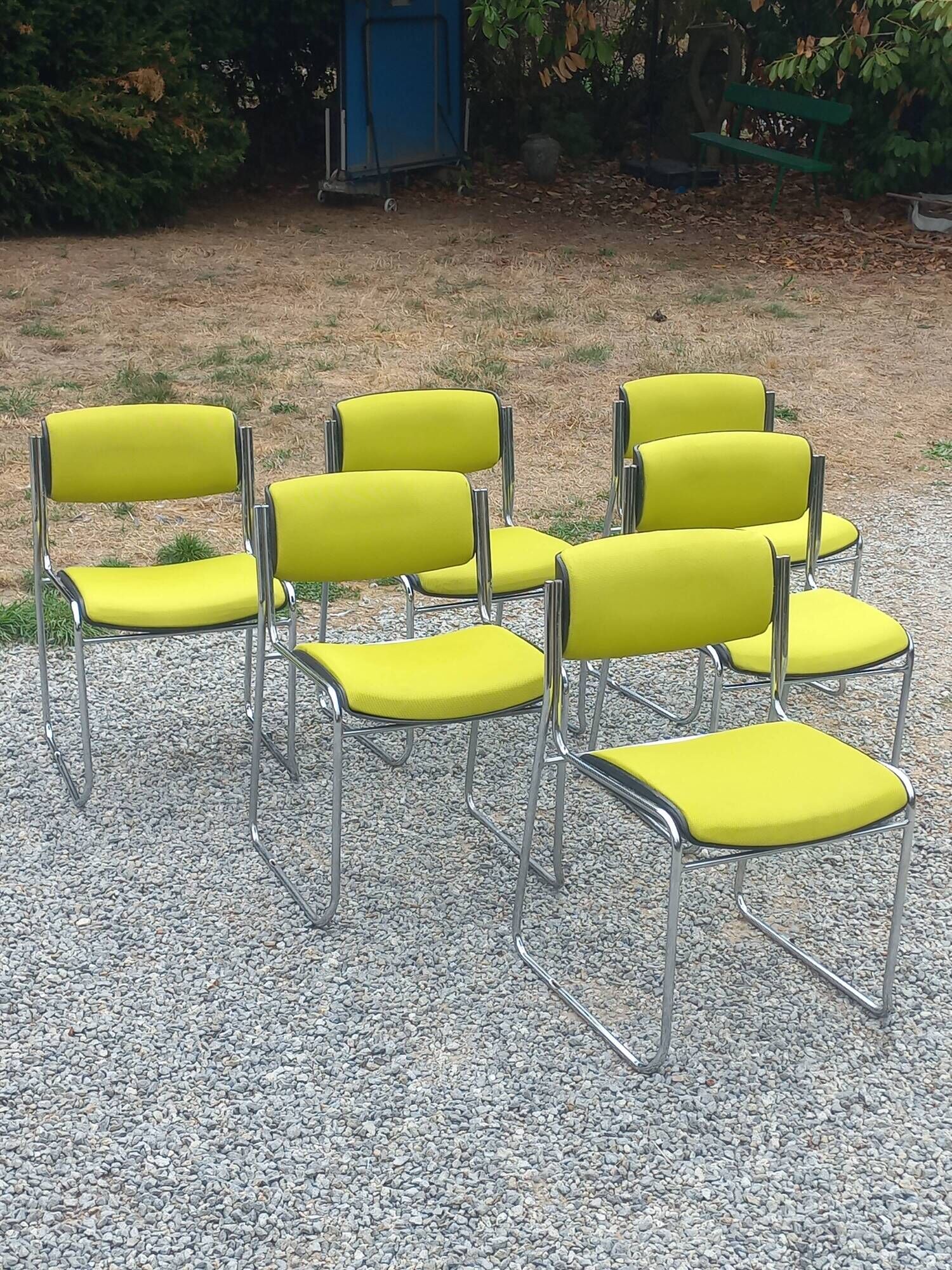 Set of 6 designer chairs with wooden seats and backs, chrome legs.