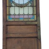 porte en chêne avec des vitraux