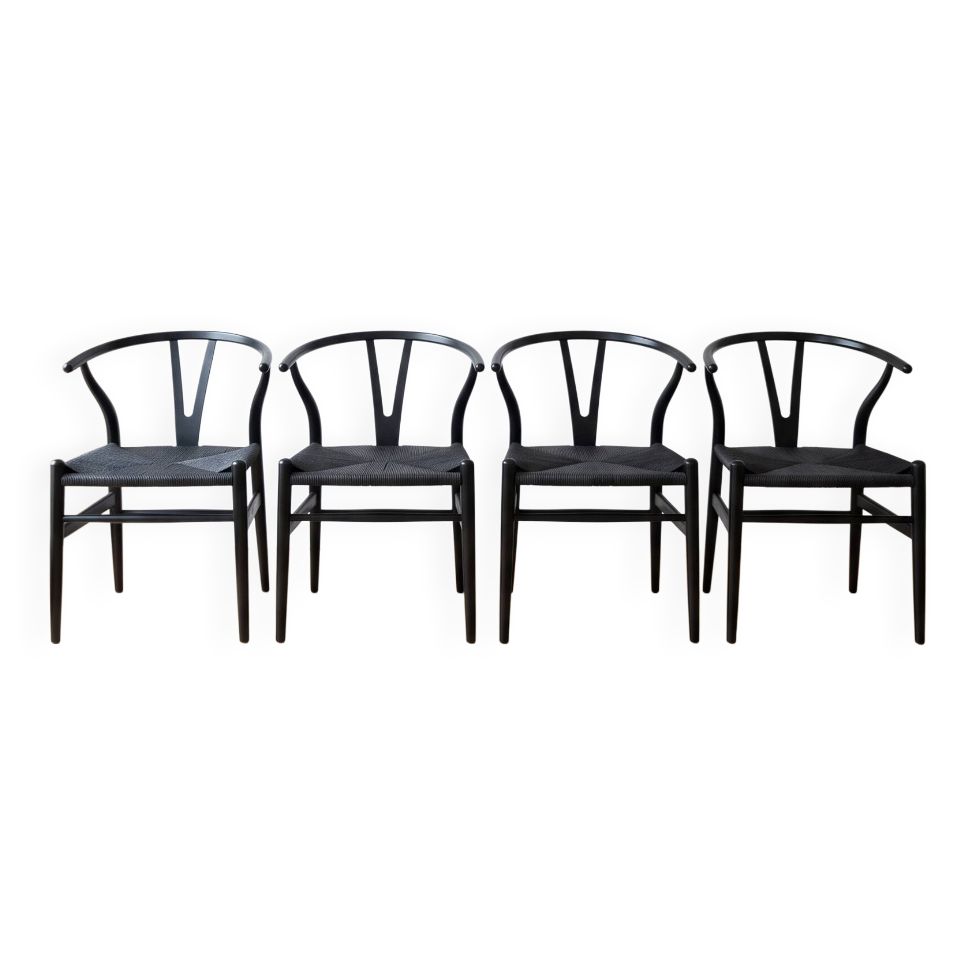 Set of 4 vintage Scandinavian Wishbone style chairs in black wood.