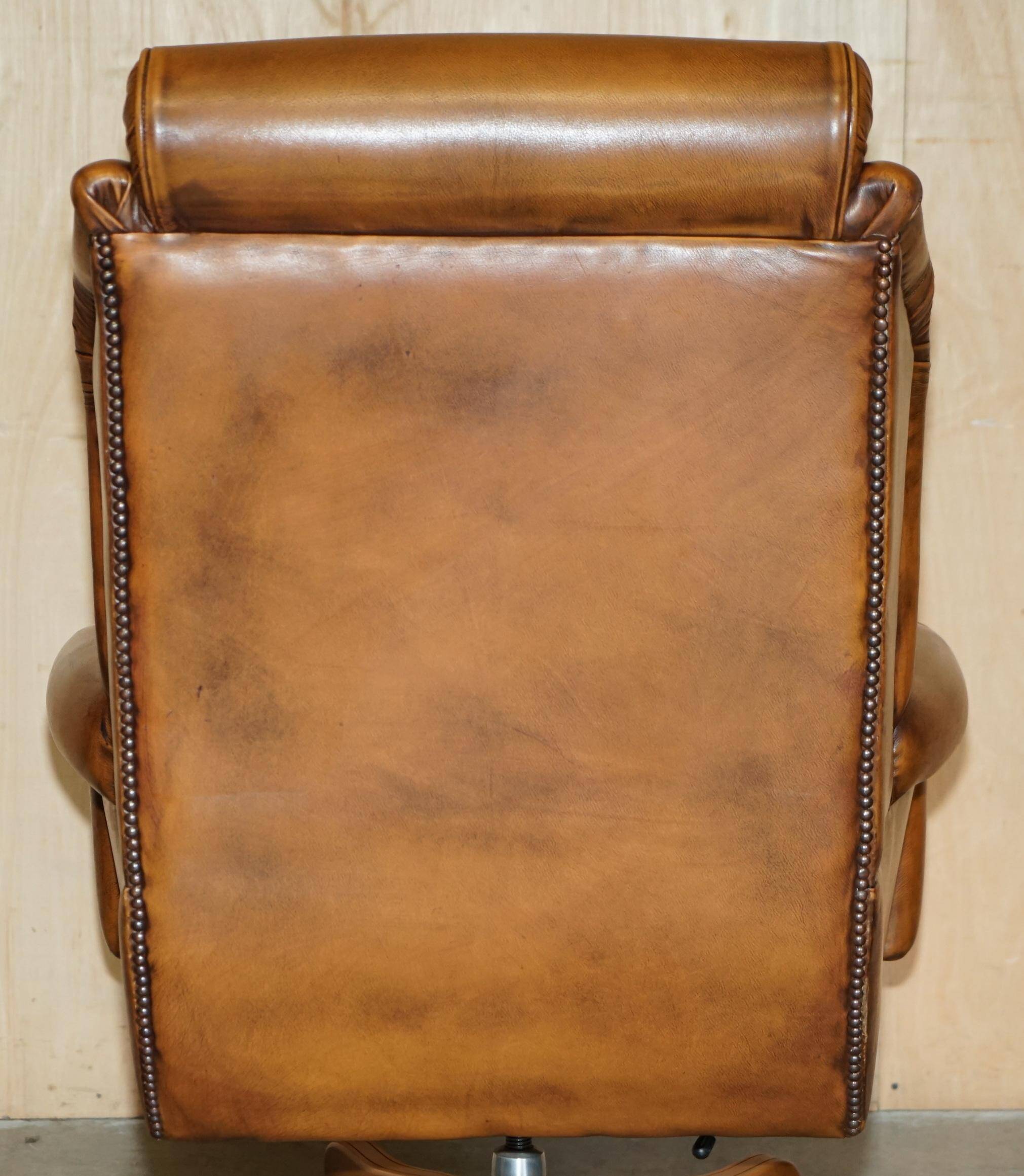 Captain's chair Chesterfield vintage leather with tufted wingback.