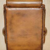 Captain's chair Chesterfield vintage leather with tufted wingback.