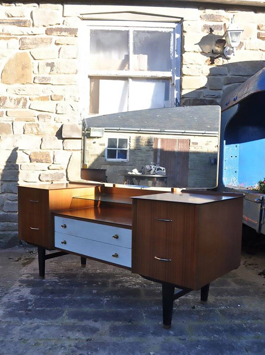 Mid-century hairdresser in brown teak and white with a mirror and brass legs.