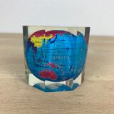 Globe paper press under resin