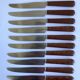 12 table knives stainless steel blade round ends / Bakelite handles with wood burl effect / 1950s