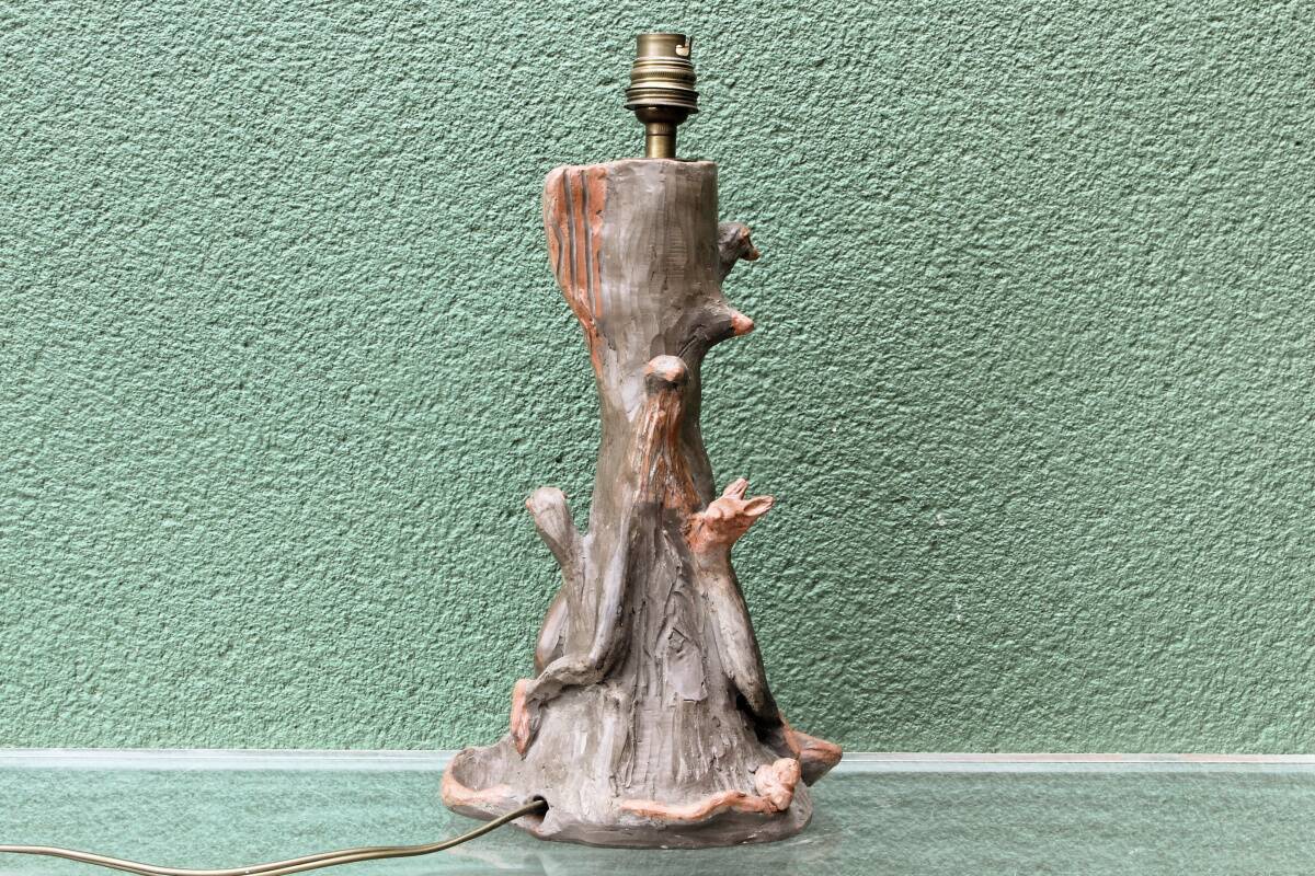 Lamp base in sculpted terracotta featuring birds, signed.