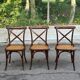 4 bistro chairs with curved wooden backs and cross braces / Crossback