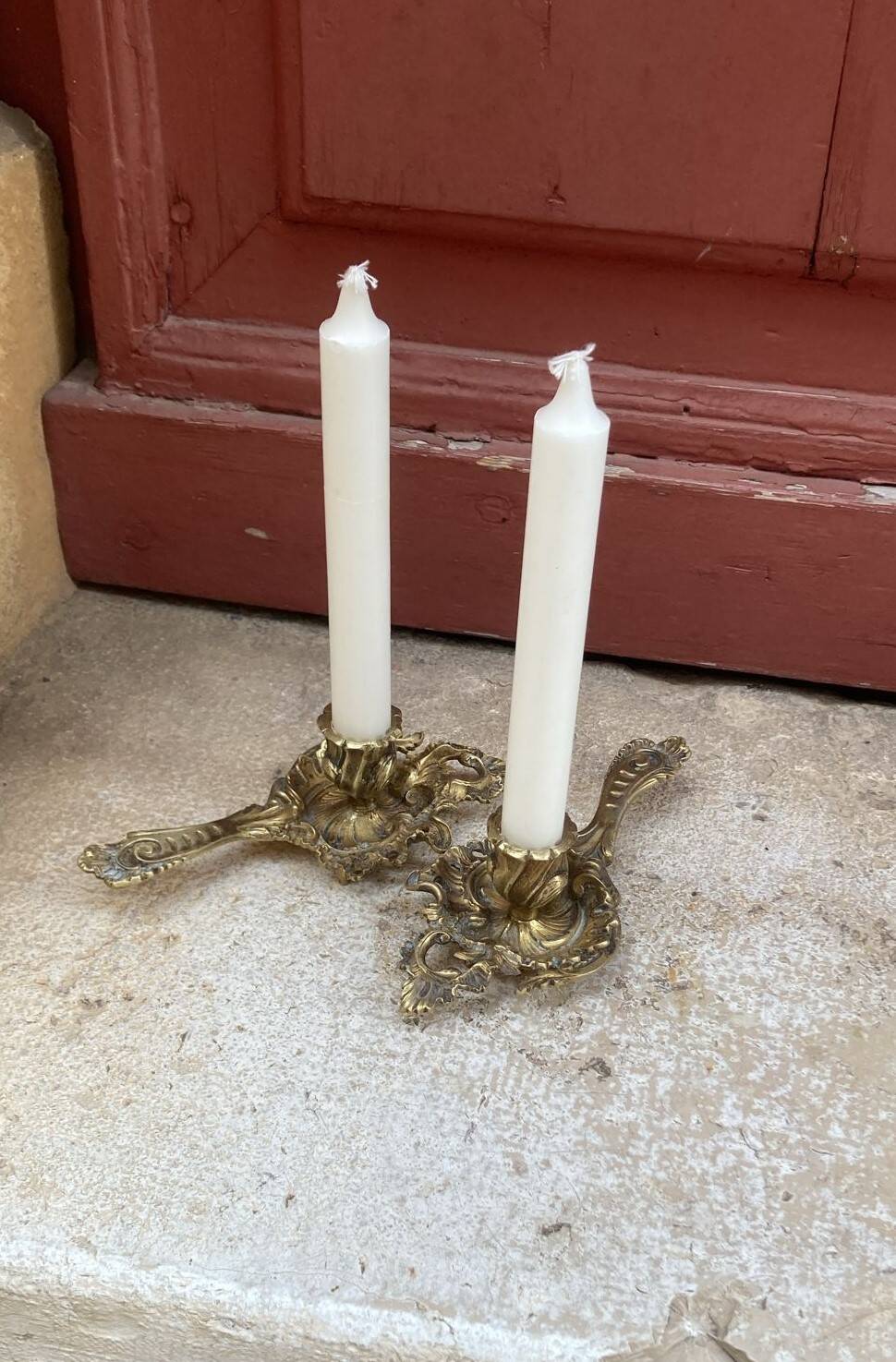 Pair of hand candlesticks / bronze candle holders