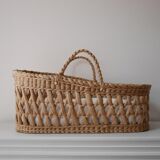 Doll bassinet with its bedding