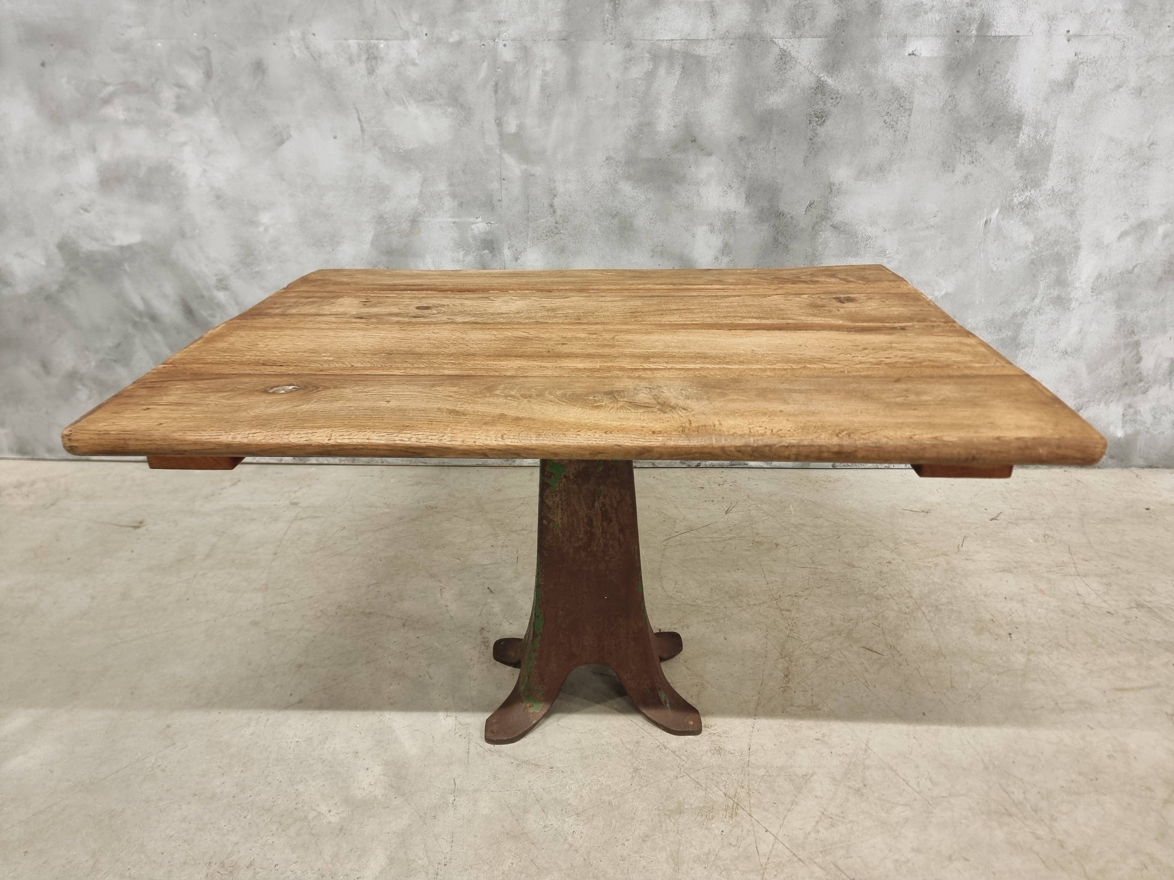 Antique oak dining table on cast iron base 93 x 123 cm