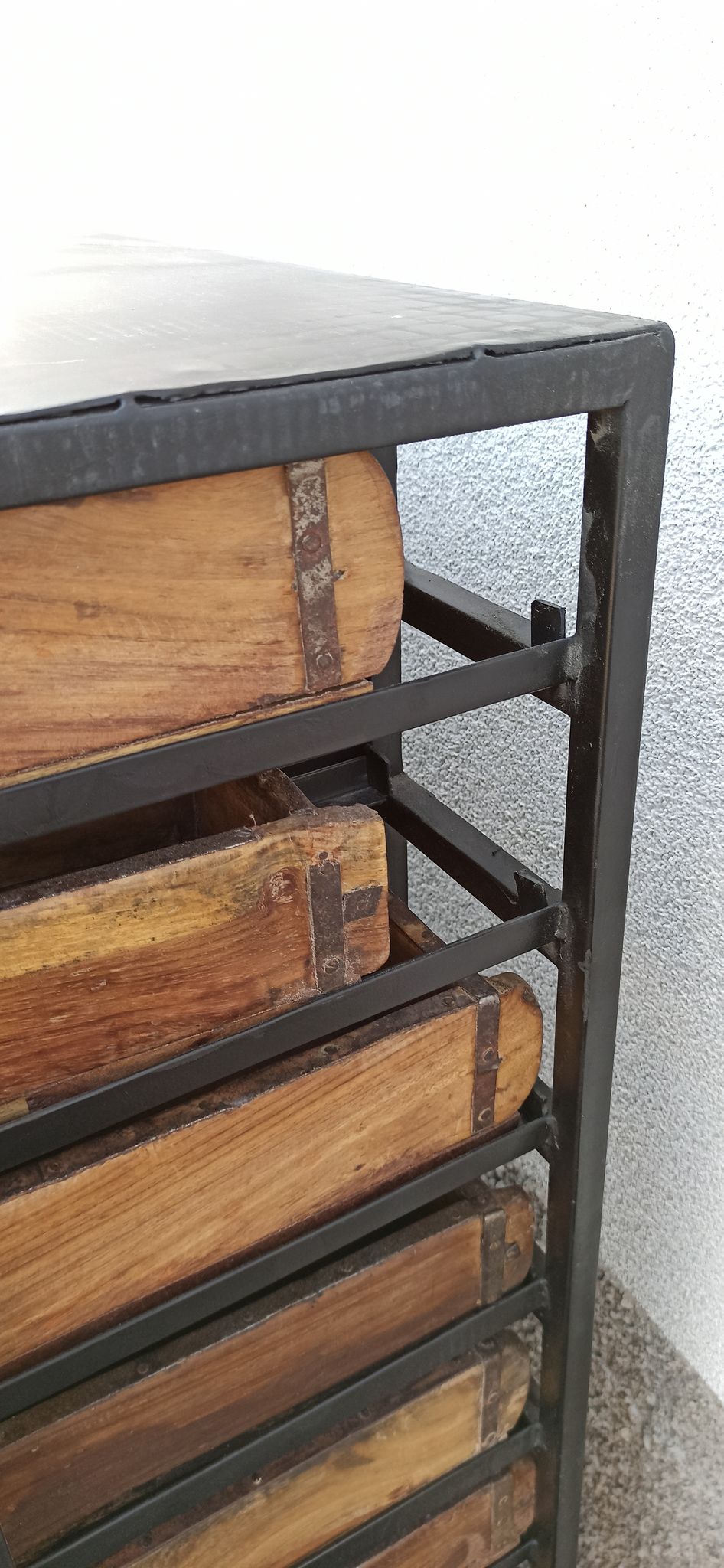 Black metal storage cabinet with 60 wooden drawers