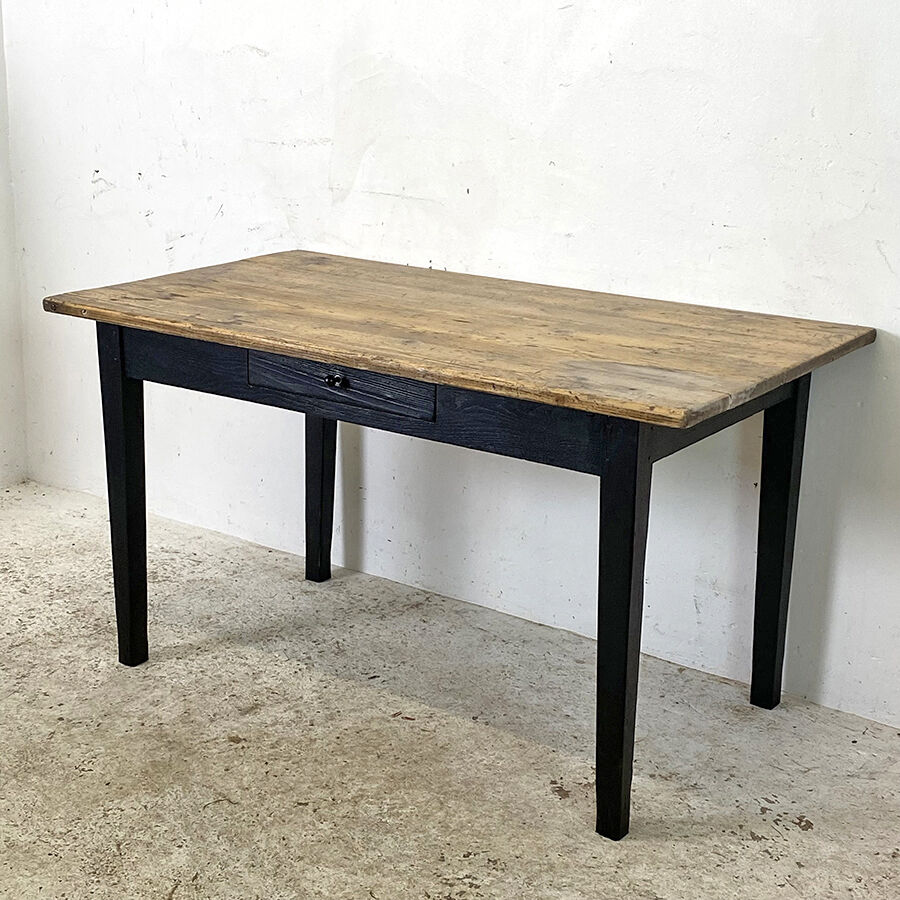 Varnished farmhouse table and blackened wood