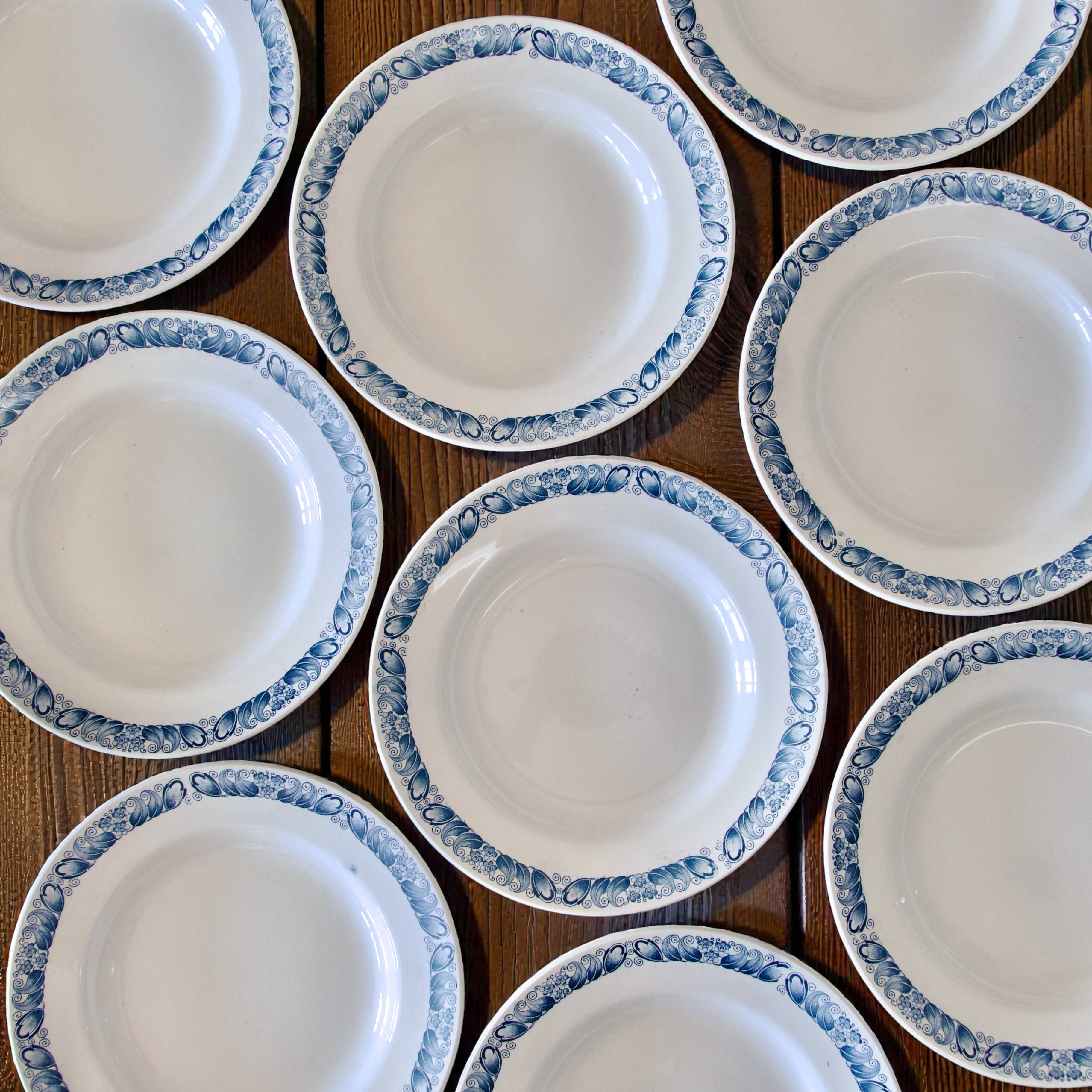 9 antique ironstone plates signed Longchamp "Marcel"