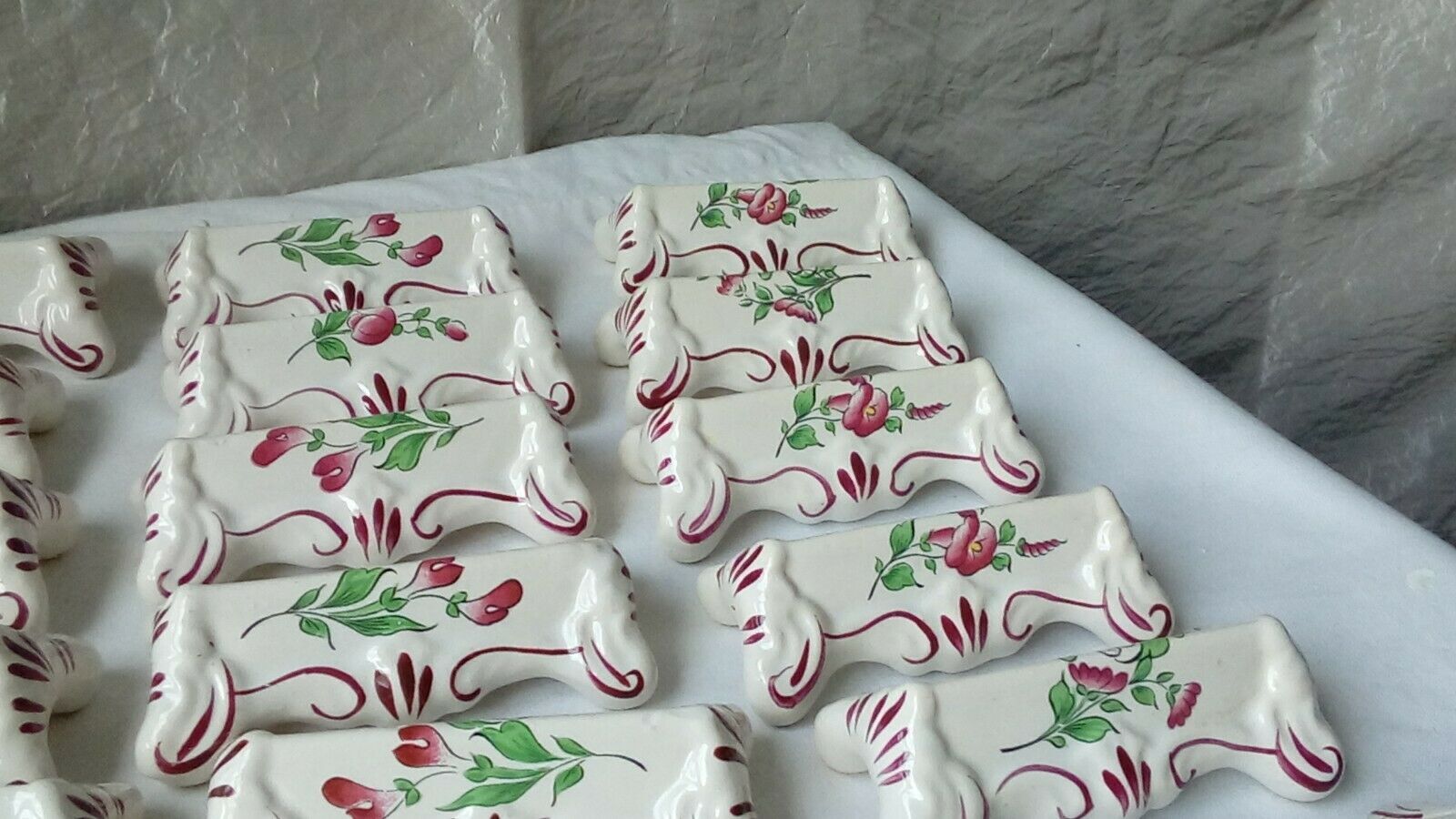 Suite of 18 knife holders in faience of luneville model reverbere