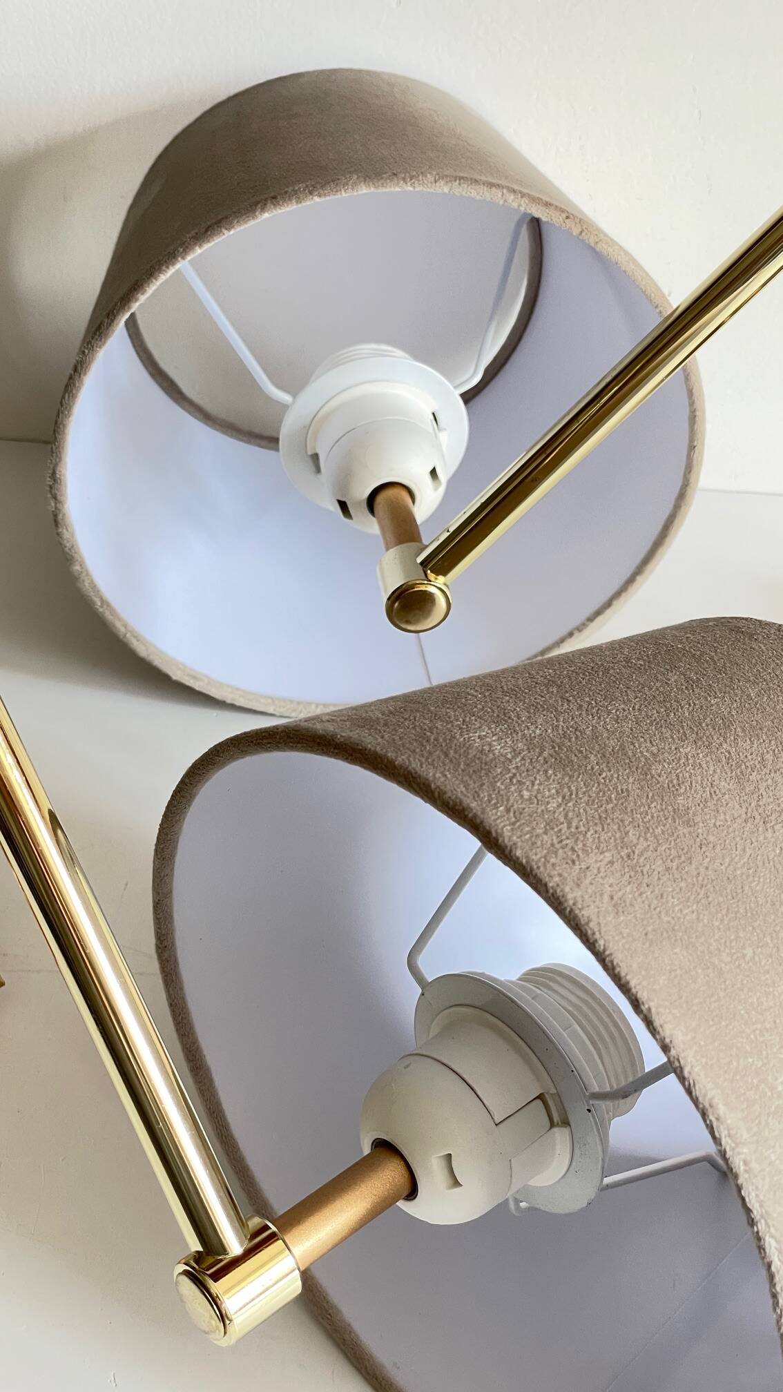 articulated brass and velvet wall light