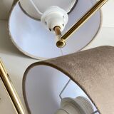 articulated brass and velvet wall light