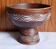 Cup on a pedestal in handcrafted scarified ceramic.