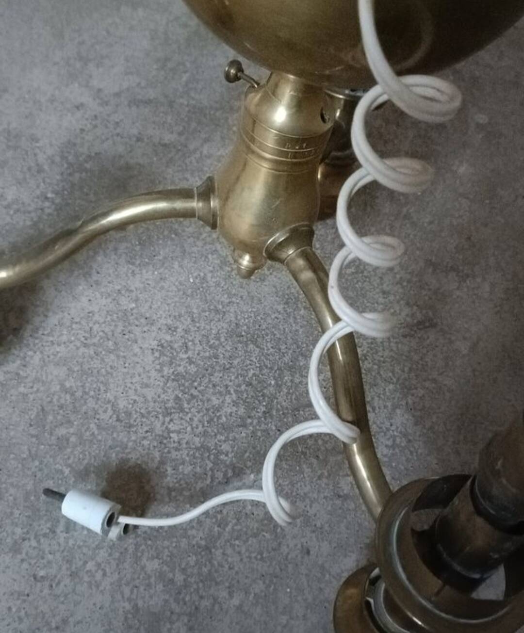 Brass chandelier with three flames.