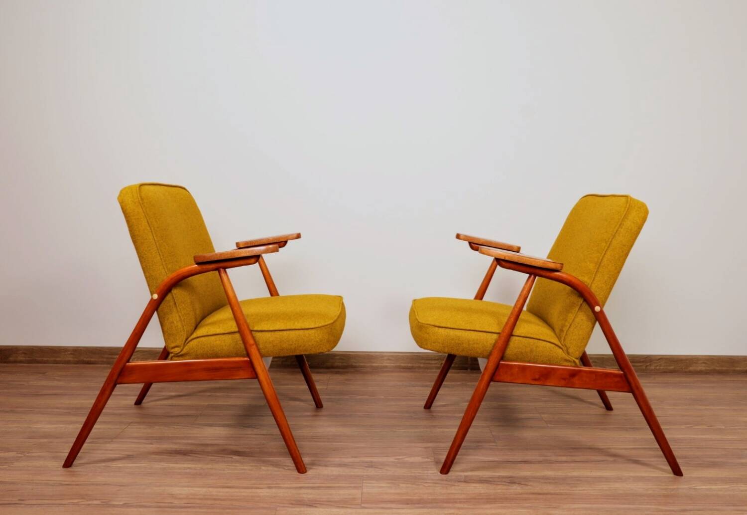 Pair of armchairs in natural wool, gilt, 1960.