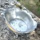 Footed pewter champagne cooler on claw feet with floral relief