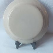 Pair of antique plates in popular earthenware with a floral basket decoration on the edge.