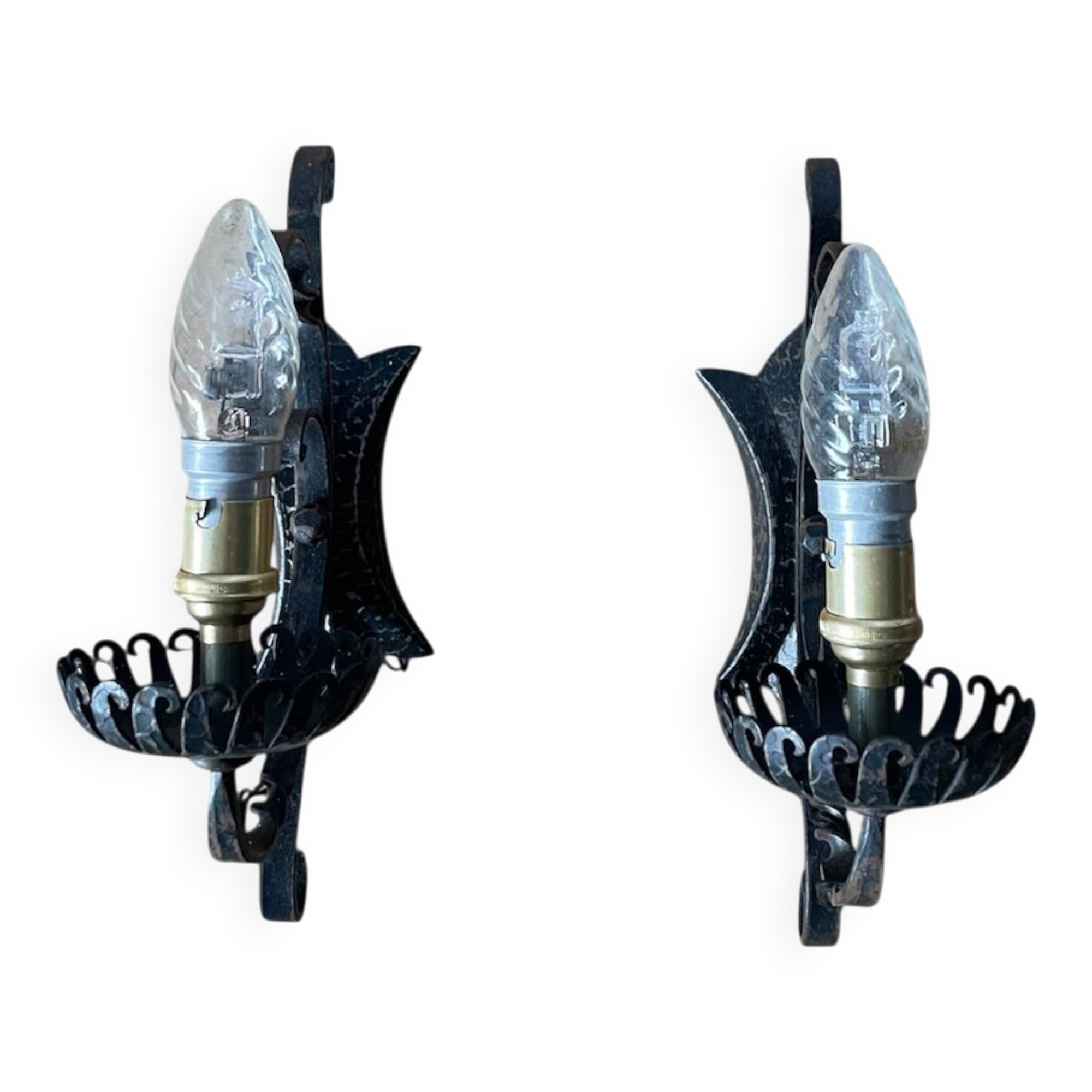 Vintage wrought iron wall lights in rustic gothic style.