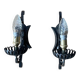 Vintage wrought iron wall lights in rustic gothic style.