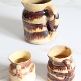 3 old bicoloured enamelled stoneware jugs