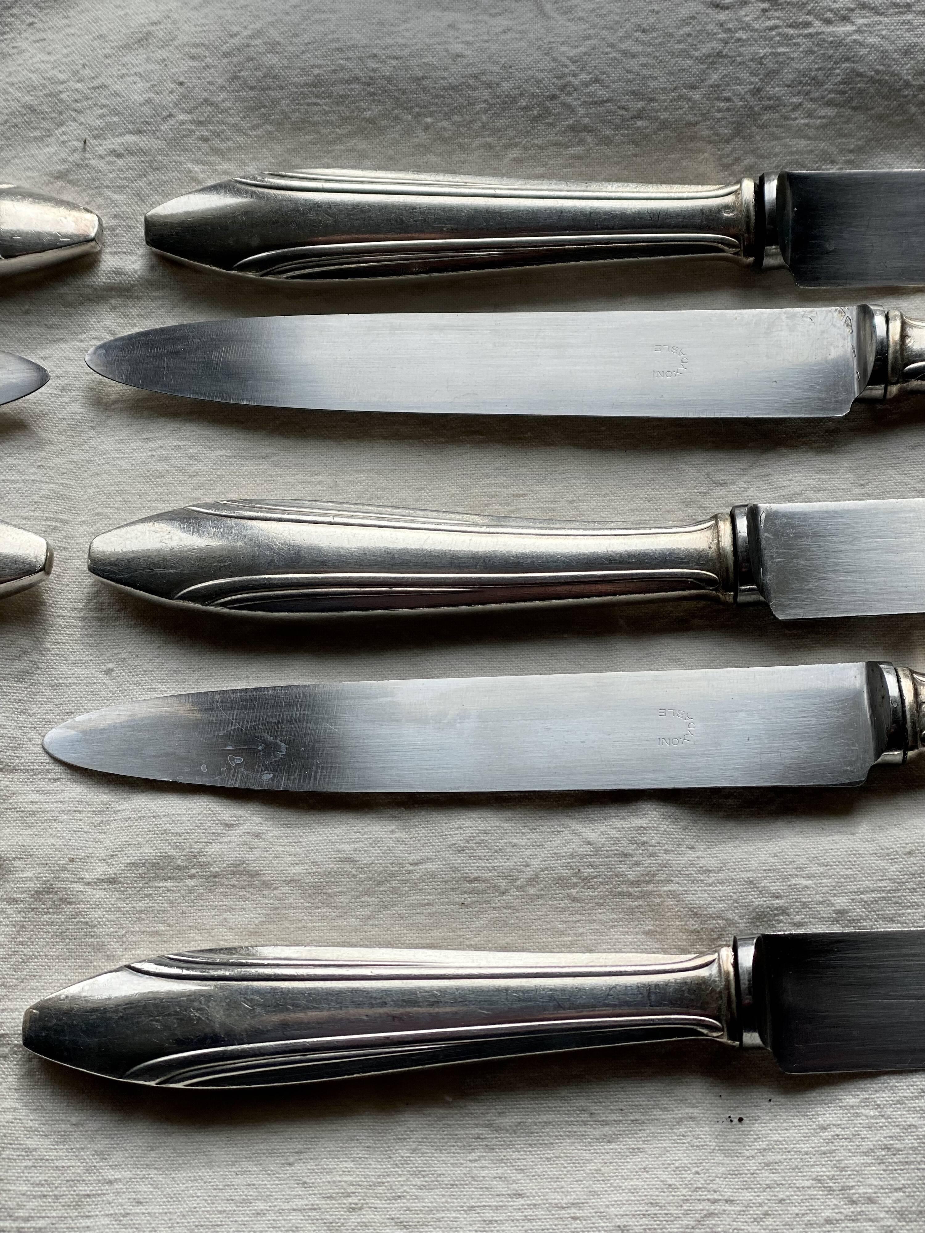 Set of 10 modernist silver-plated metal table knives.
