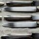 Set of 10 modernist silver-plated metal table knives.
