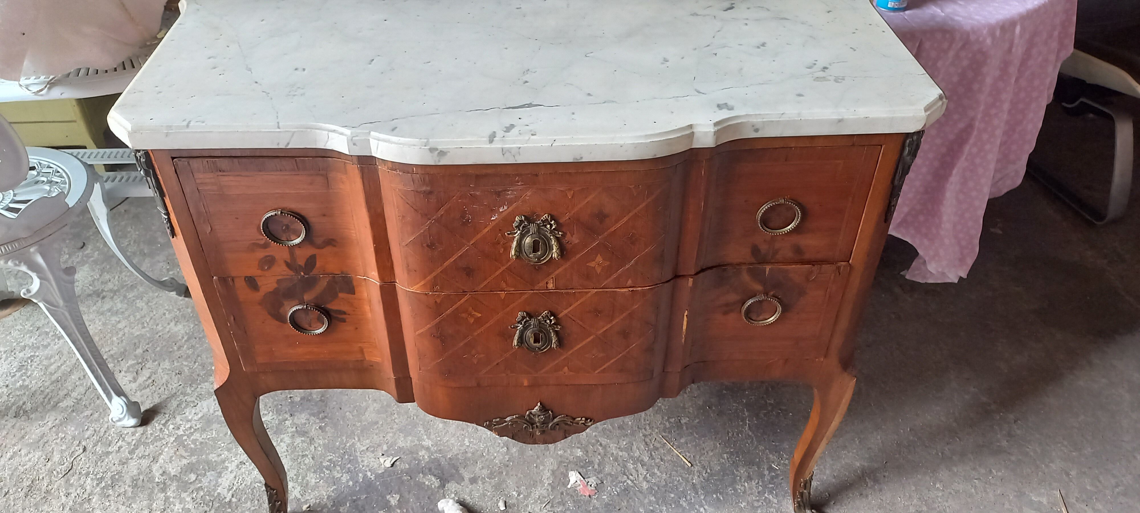 Louis XVI period chest of drawers with marble.