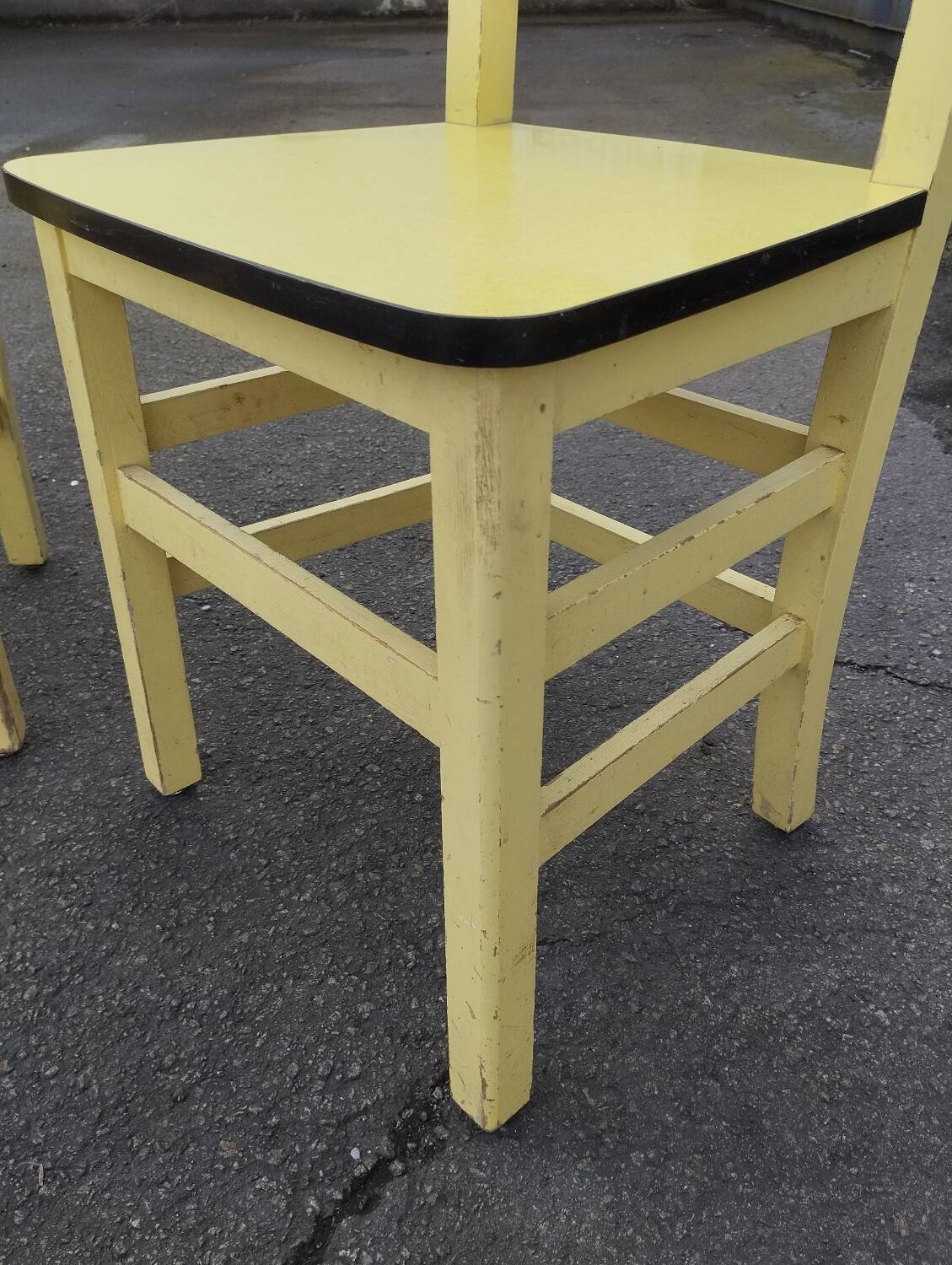 Pair of wooden and yellow formica chairs