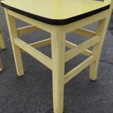 Pair of wooden and yellow formica chairs