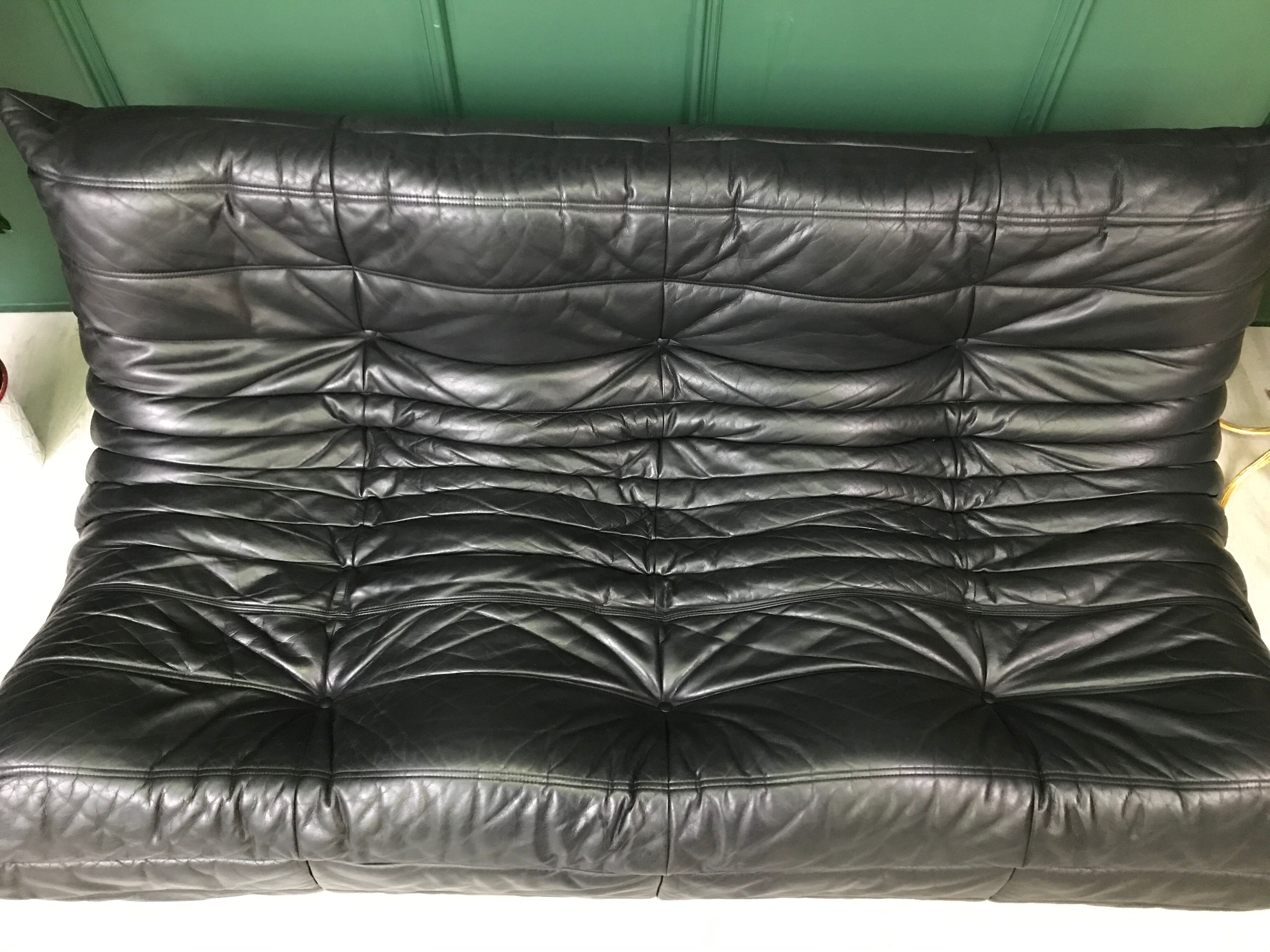 Black leather three seater sofa Togo by Ligne Roset
