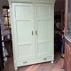 Antique painted green wooden wardrobe
