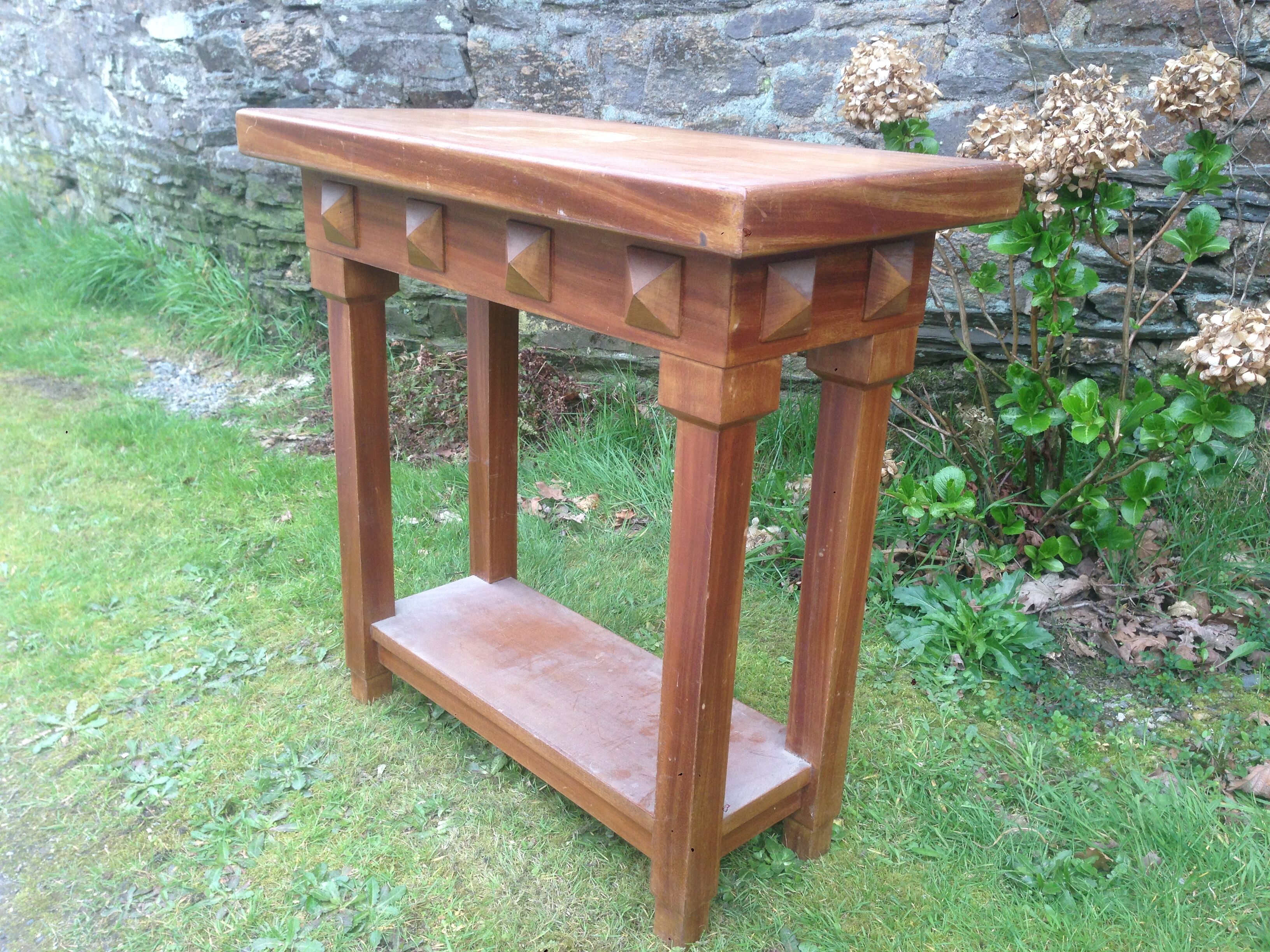 Art deco console in solid mahogany with diamond tips.
