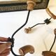 Trio of antique wooden and metal coat hooks