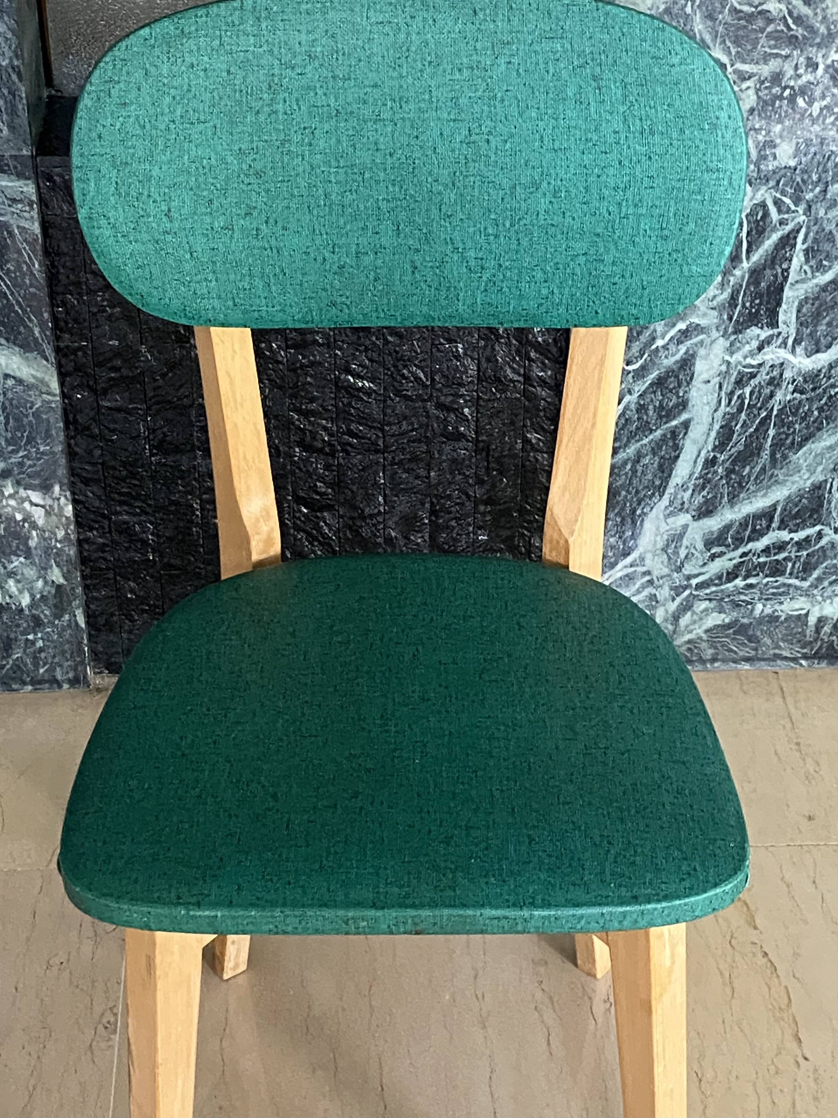 Paire de chaises vintage skaï vert pieds compas