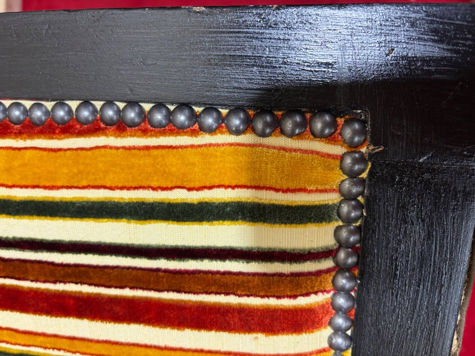 Art Deco armchair in multicolored striped fabric and its footrest