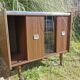 Furniture bar showcase with vintage wheels