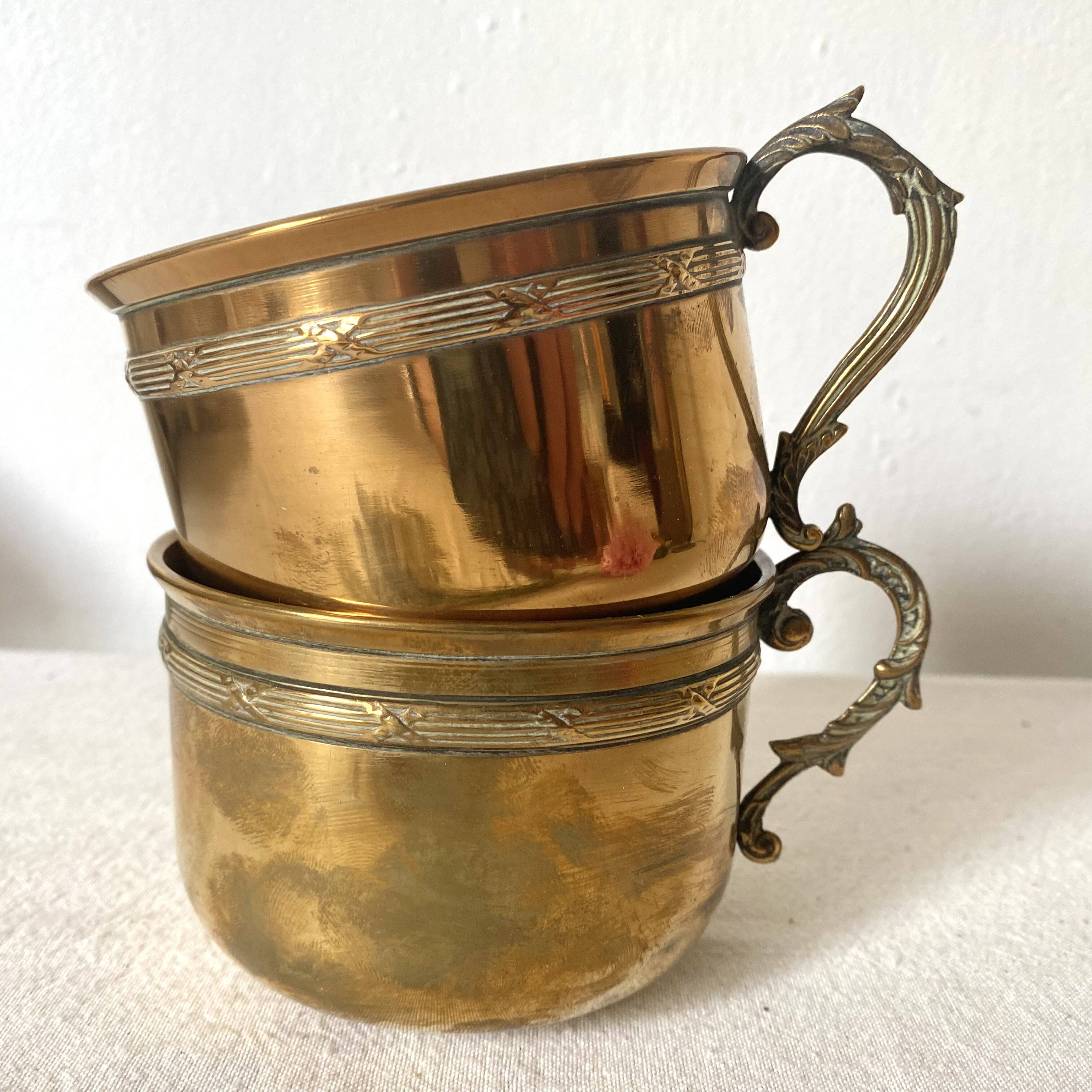 Antique brass cups