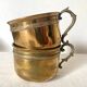 Antique brass cups