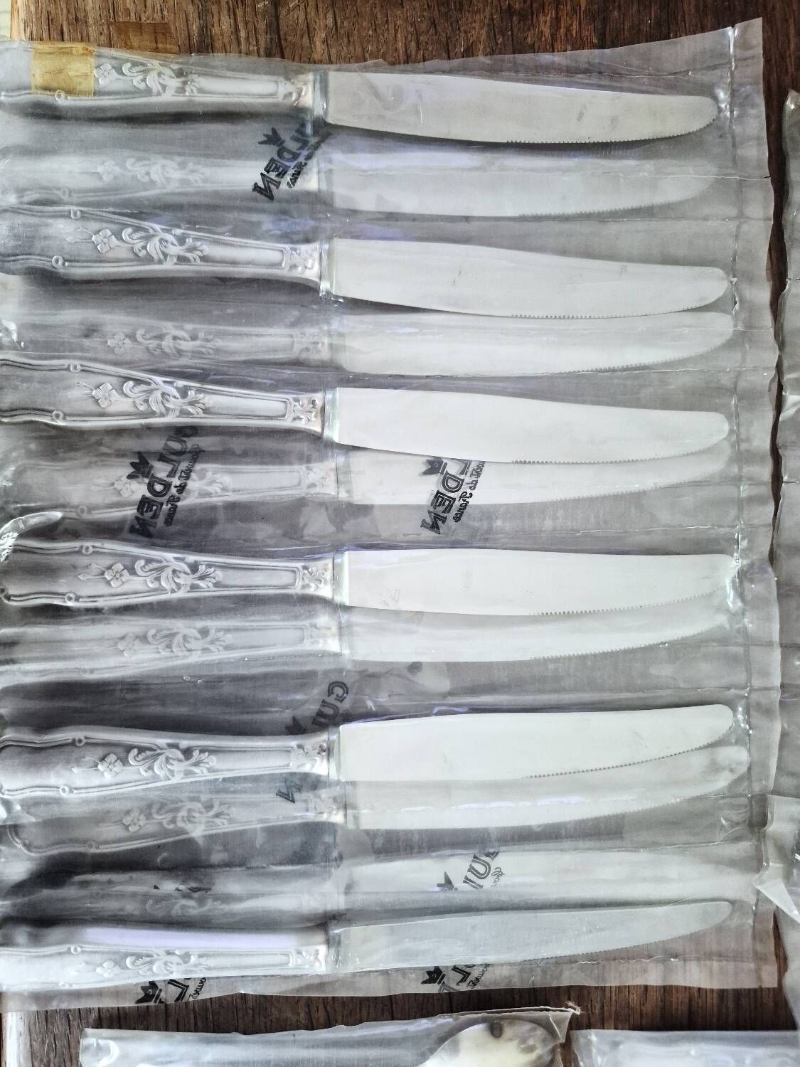 48 new silver-plated metal cutlery pieces in blister packaging.