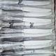 48 new silver-plated metal cutlery pieces in blister packaging.