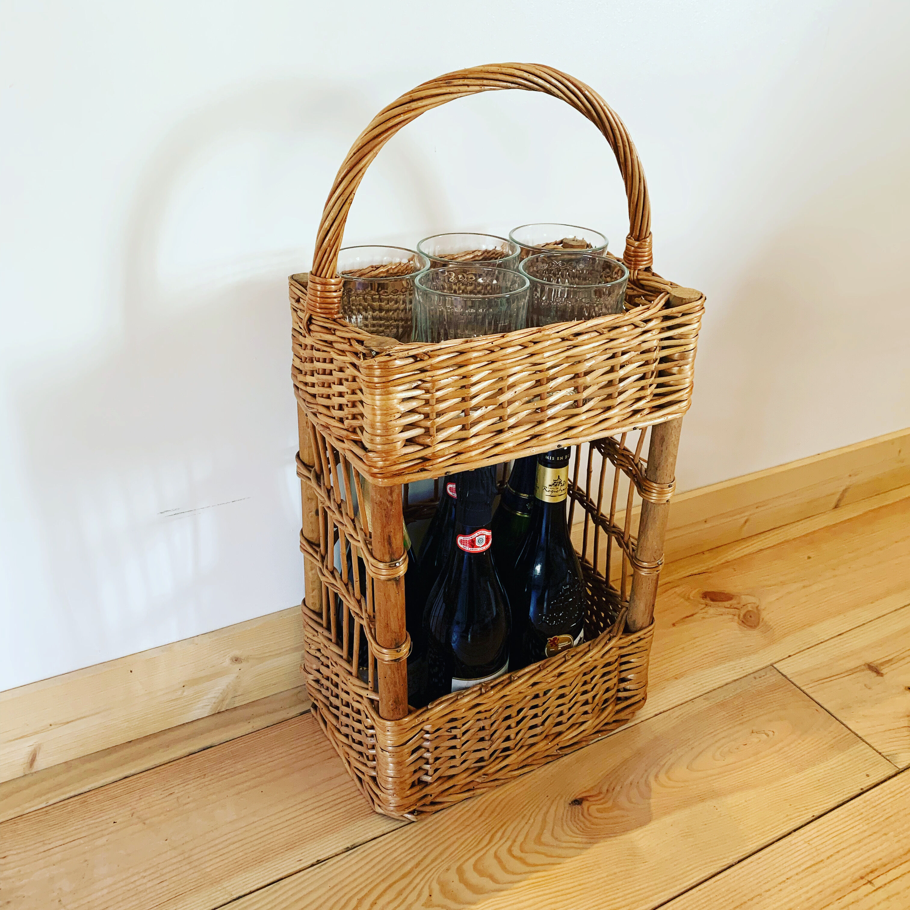 Vintage wicker bottle bar