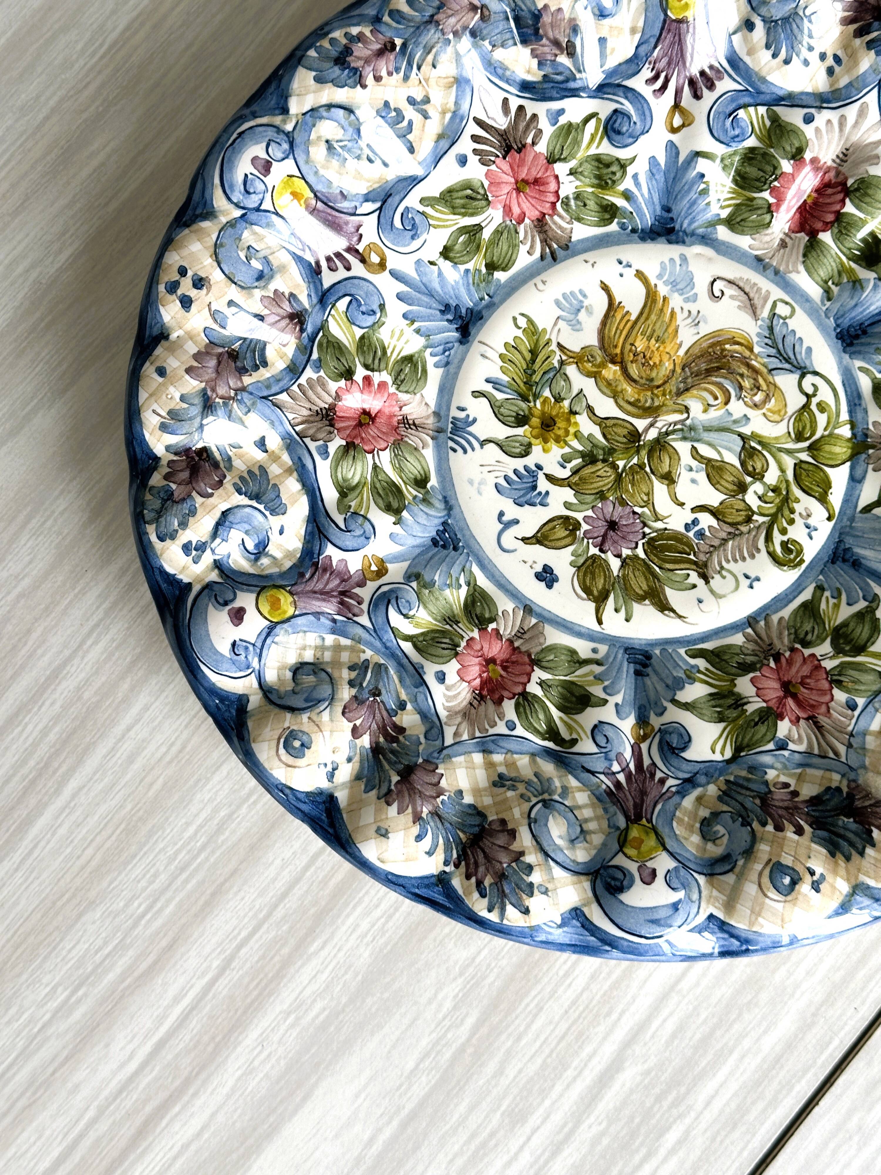 Large decorative dish hand painted with floral and bird motifs